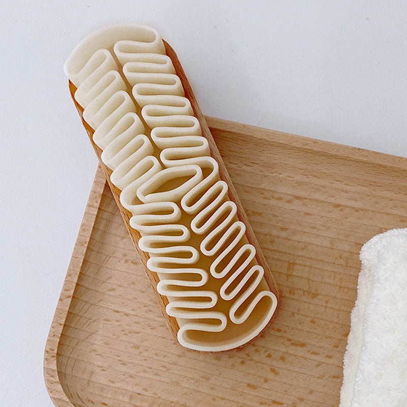 Schuhbürste aus weichem Gummi mit Holzgriff